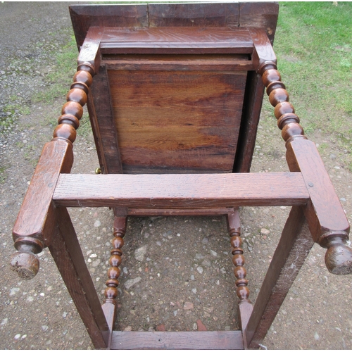 39 - An Antique oak table, fitted with a frieze drawer, on turned legs united by stretchers, 23ins x 36in... 