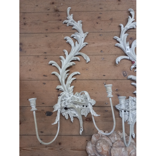 390 - A pair of wall sconces and a carving