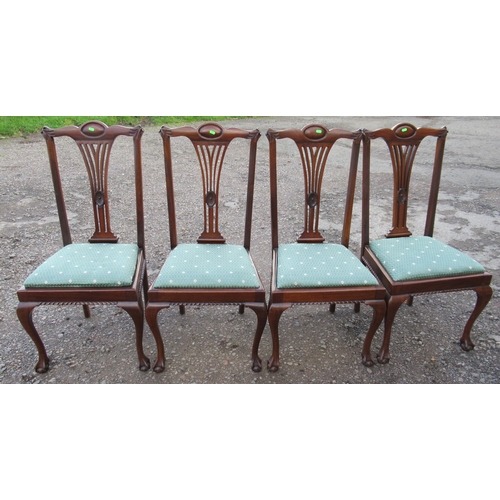 48 - A set of four mahogany dining chairs, with pierced vase splat and drop in seats