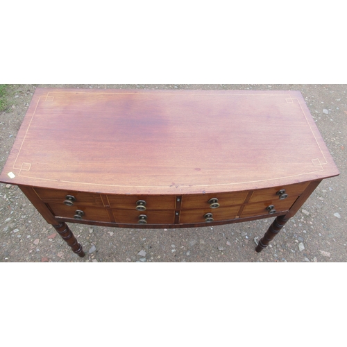 55 - A 19th century mahogany bow front sidetable, with satinwood line inlay, fitted with two drawers, on ... 