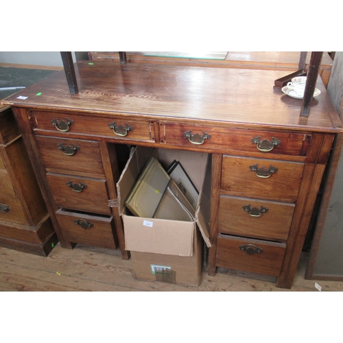 63 - A desk, fitted with eight drawers around the kneehole, 48ins x 23.5ins, height 32.5ins