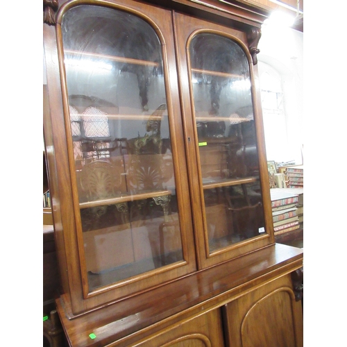 52 - A 19th century mahogany bookcase cabinet, the upper section fitted with a pair of glazed doors with ... 