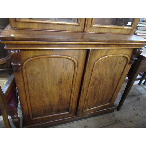 52 - A 19th century mahogany bookcase cabinet, the upper section fitted with a pair of glazed doors with ... 