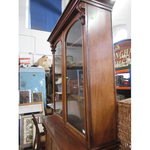 52 - A 19th century mahogany bookcase cabinet, the upper section fitted with a pair of glazed doors with ... 