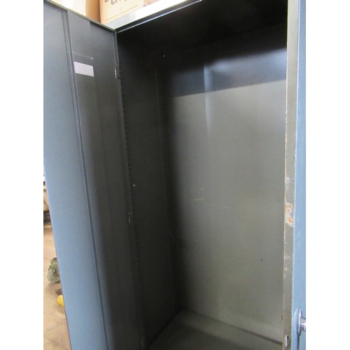 8 - A metal cupboard  72ins x 36ins depth 18ins