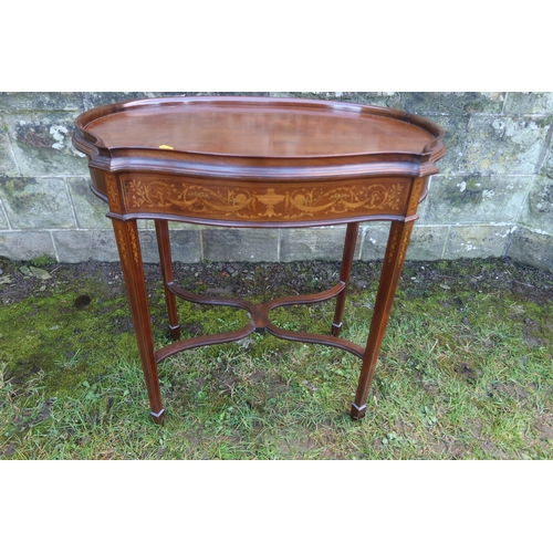 14 - An Edwardian shaped occasional table, with a marquetery front frieze, raised on square tapering legs... 