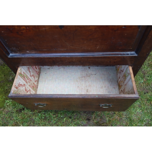 16 - An unusual slim oak mule chest, with panel front and plain raising lid, draw below, width 30ins