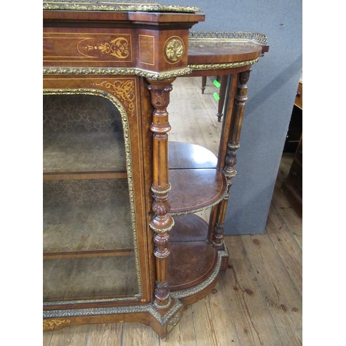 28 - A late 19th century burr walnut credenza with central glazed door flanked by quarter open shelves wi... 