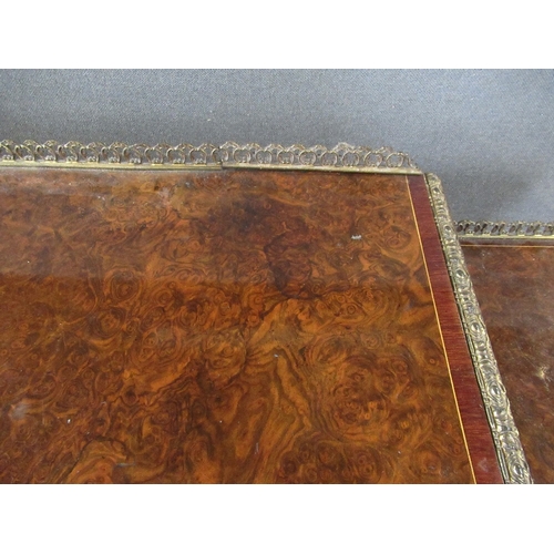 28 - A late 19th century burr walnut credenza with central glazed door flanked by quarter open shelves wi... 