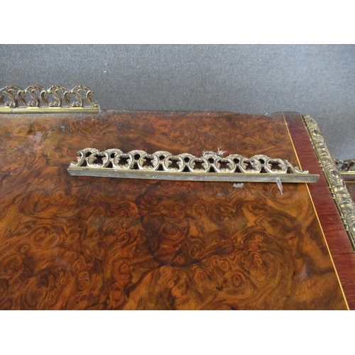 28 - A late 19th century burr walnut credenza with central glazed door flanked by quarter open shelves wi... 