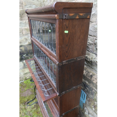 31 - A Globe Wernicke leaded light four section bookcase, width 34ins, depth 14ins, height 60ins