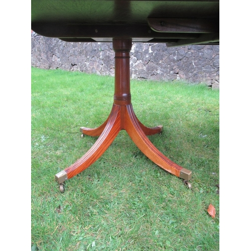 34 - A reproduction mahogany twin pedestal table, with two extra leaves max  length 100ins