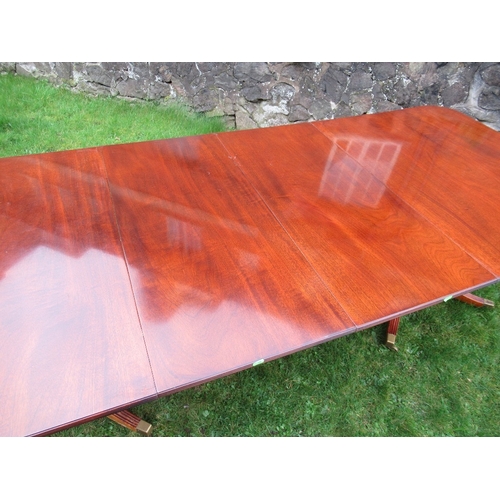 34 - A reproduction mahogany twin pedestal table, with two extra leaves max  length 100ins