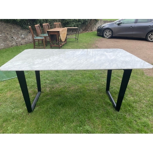 4 - A Camerich carrera marble topped dining table, raised on black ash base, 36ins x 64ins together with... 