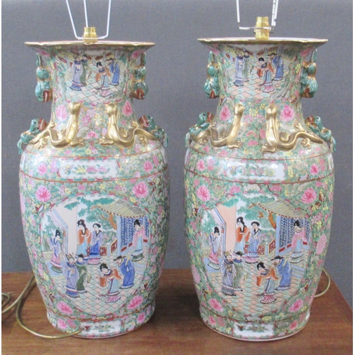 431 - A pair of 20th century Chinese famille rose vases, converted to lamps, decorated with warriors and f... 