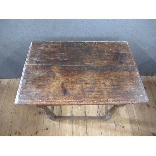 44 - An Antique oak side table, fitted with frieze drawer, raised on turner legs, united by stretcher, wi... 