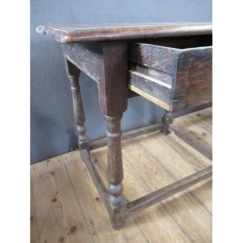 44 - An Antique oak side table, fitted with frieze drawer, raised on turner legs, united by stretcher, wi... 