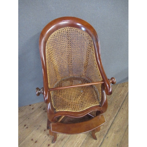 49 - A 19th century mahogany childs caned back chair, raised on a table, with cabriole legs height 40ins