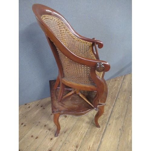 49 - A 19th century mahogany childs caned back chair, raised on a table, with cabriole legs height 40ins