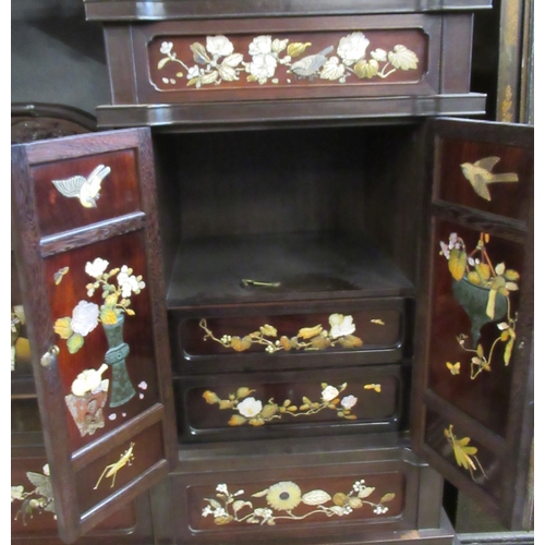 5 - A Japanese shibayama cabinet, fitted with shelves, cupboards and drawers, decorated with flowers, in... 