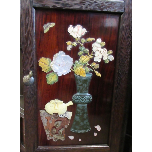 5 - A Japanese shibayama cabinet, fitted with shelves, cupboards and drawers, decorated with flowers, in... 