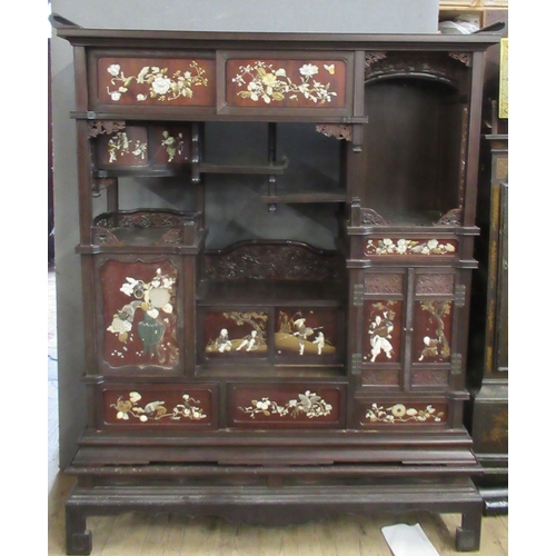 5 - A Japanese shibayama cabinet, fitted with shelves, cupboards and drawers, decorated with flowers, in... 