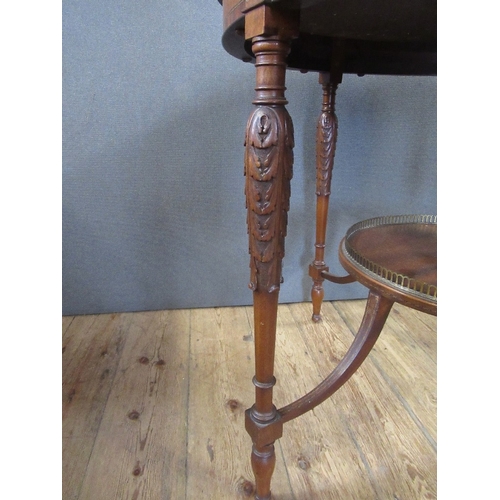 52 - A good Victorian Mahogany boxwood and ebony circular center table raised on turned legs , united by ... 