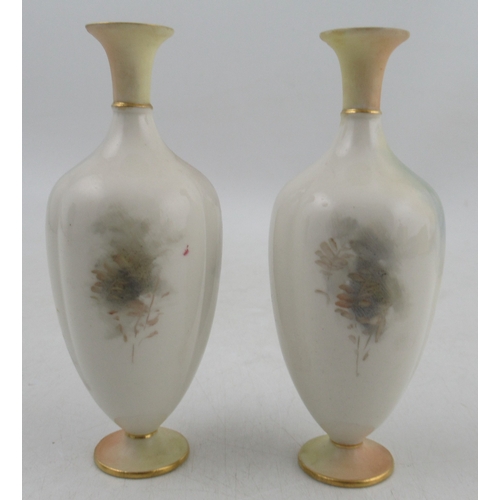 563 - A pair of Royal Worcester vases, decorated with pheasants in a landscape by J Stinton, with blush iv... 