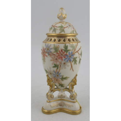 565 - A Grangers Worcester vase, raised on a pedestal, with pierced neck, decorated with shot silk colours... 