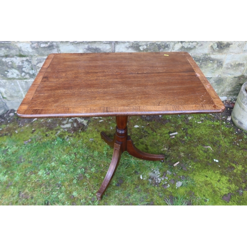 59 - A rectangular cross banded occasional table, raised on a tripod base, 32.5ins x 31ins