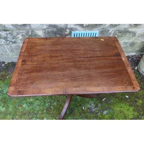 59 - A rectangular cross banded occasional table, raised on a tripod base, 32.5ins x 31ins