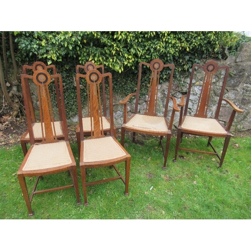 6 - A set of six oak dining chairs, with pewter and ebonized inlay, in the style of George Montague Ellw... 