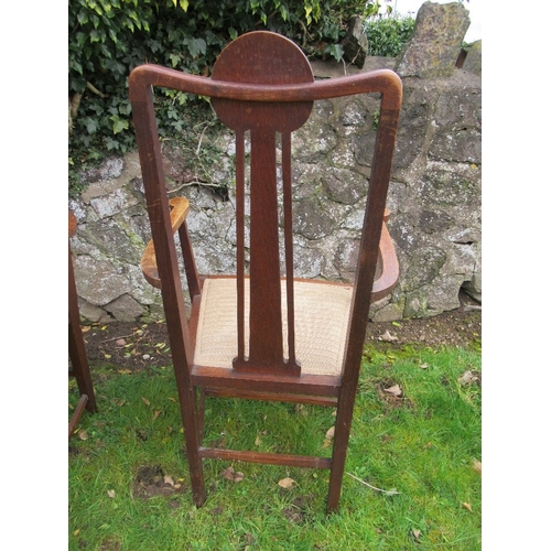 6 - A set of six oak dining chairs, with pewter and ebonized inlay, in the style of George Montague Ellw... 