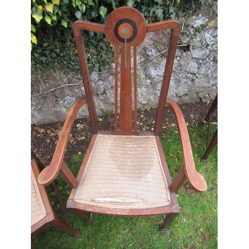 6 - A set of six oak dining chairs, with pewter and ebonized inlay, in the style of George Montague Ellw... 