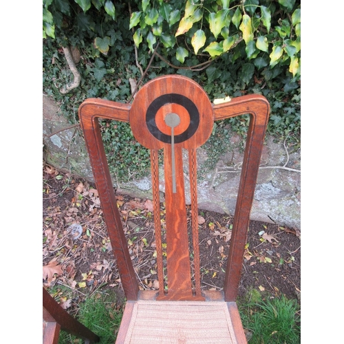 6 - A set of six oak dining chairs, with pewter and ebonized inlay, in the style of George Montague Ellw... 