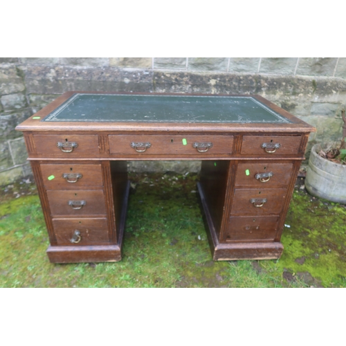 61 - A late 19th century oak pedestal desk, fitted with three frieze drawers and two pedestals of three d... 