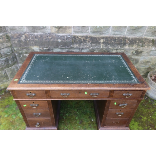 61 - A late 19th century oak pedestal desk, fitted with three frieze drawers and two pedestals of three d... 