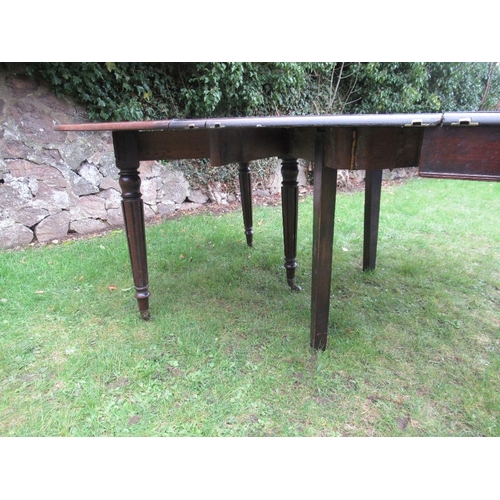 67 - A 19th century mahogany extending dining table, with concertina action and extra leaf raised on reed... 