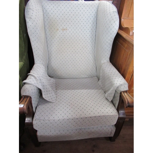 7 - A 19th century style wing back armchair