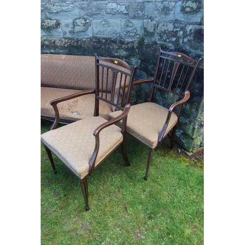 9 - An Edwardian mahogany salon suite, with bone inlay, comprising two seat sofa, two arm chairs, two el... 