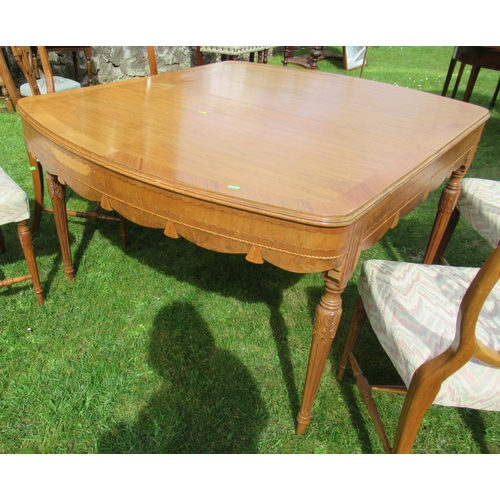 64 - An oak dining table, with carved frieze and legs, 45.5ins x 52ins, height 29ins, together with a set... 