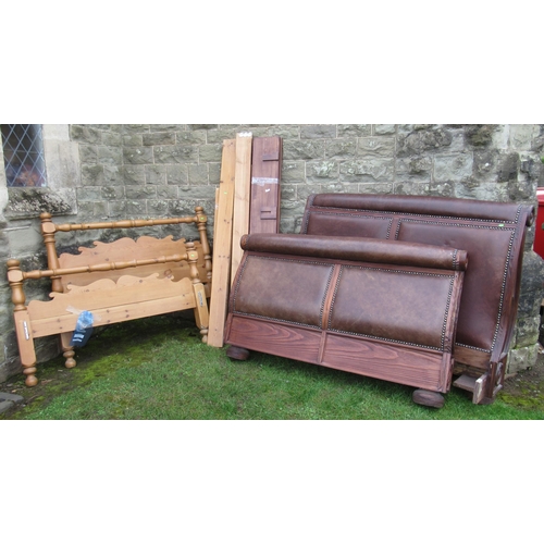 70 - A wood and leather double sleigh bed, together with a pine double bed