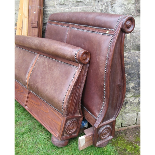 70 - A wood and leather double sleigh bed, together with a pine double bed