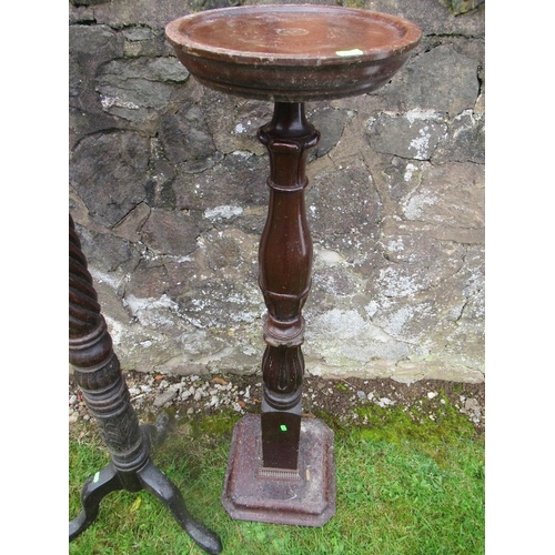 88 - Two 19th century mahogany torcheres, height 53ins and 46ins