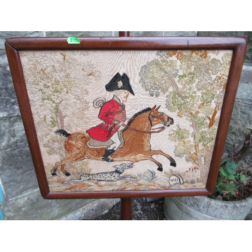 14 - A 19th century mahogany pole scree, the tapestry panel decorated with a hunting scene