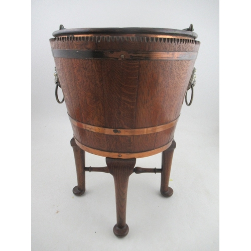 155 - A 19th century coopered oak copper banded wine cooler with lift out liner