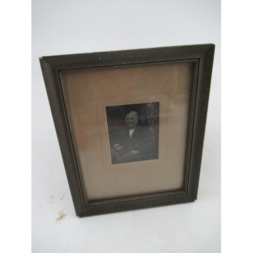 160 - A small Victorian trompe l'oeil overpainted photograph of a gentleman