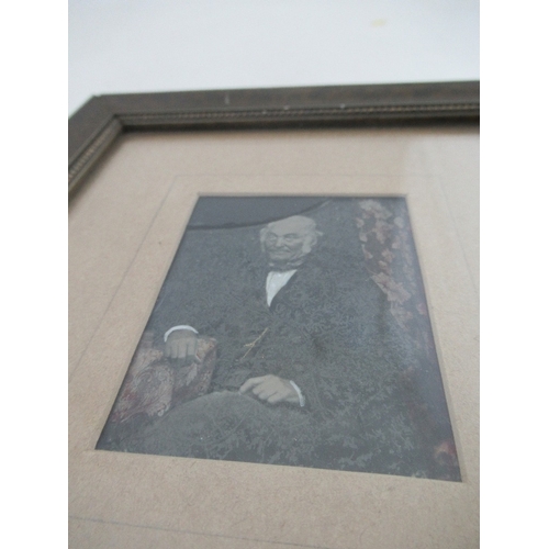 160 - A small Victorian trompe l'oeil overpainted photograph of a gentleman