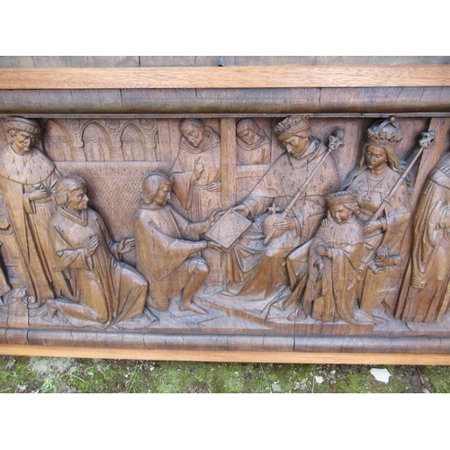 164 - A rectangular carved wooden panel, carved in relief with medieval figures at court, attributed to Fo... 