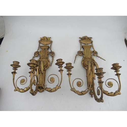 166 - A pair of  Antique Chippendale style wood and gesso gilt three light candelabra surmounted by an urn... 